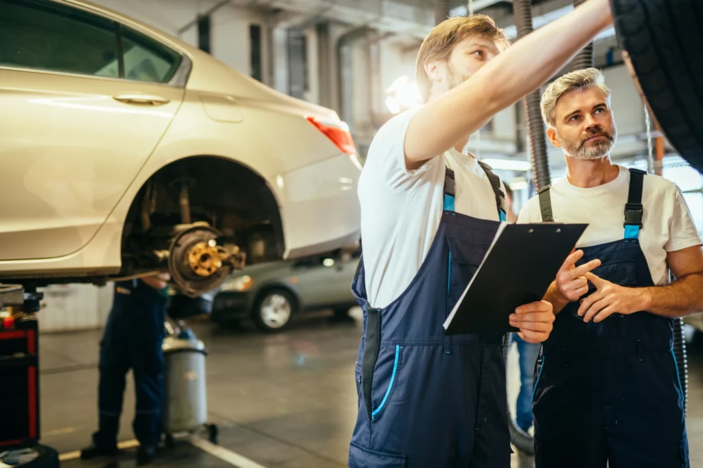 mechanic checking car before inspection