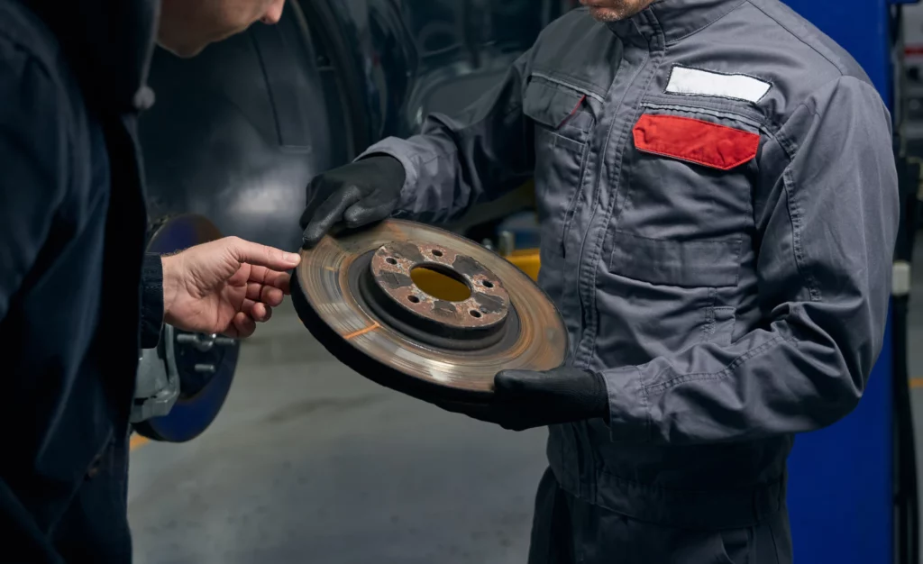 Worn brake disc being replaced in Dublin auto workshop